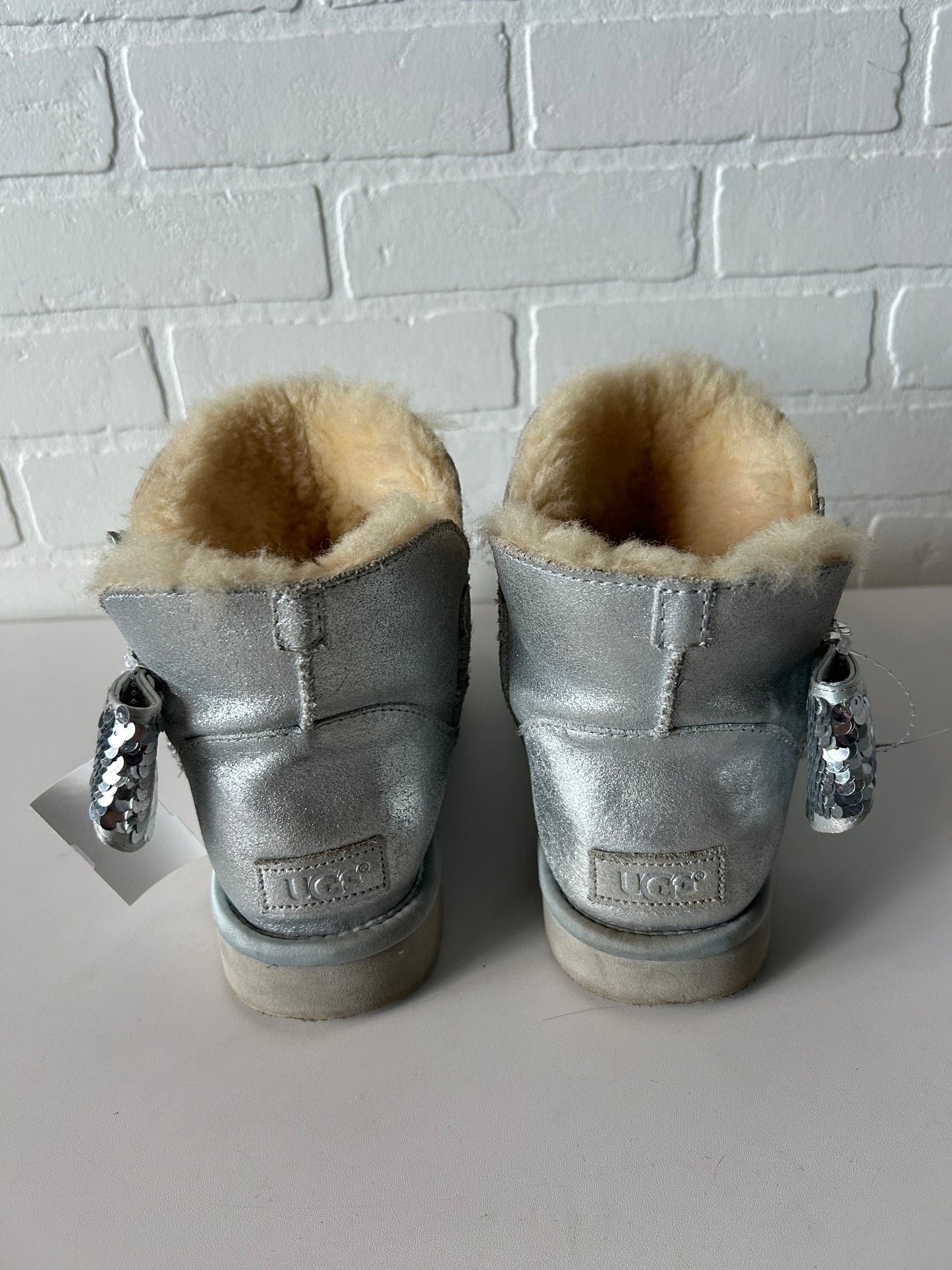 Boots Designer By Ugg In Silver, Size: 9